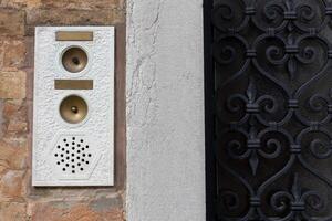 Vintage Door Intercom and Wrought Iron Gate photo