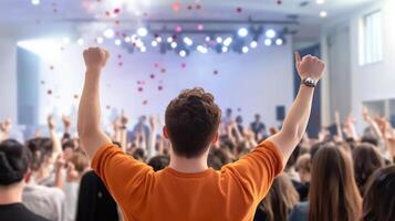 Crowd cheering at a performance, celebrating success and a winning moment photo