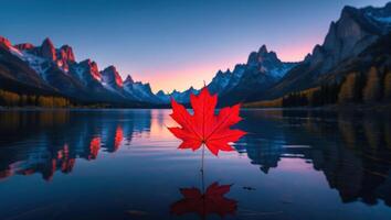 Red Maple Leaf Floating on Calm Lake with Mountain Backdrop photo