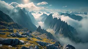 Mountain Peaks Emerging Above Clouds with Rocky Terrain and Meadow photo