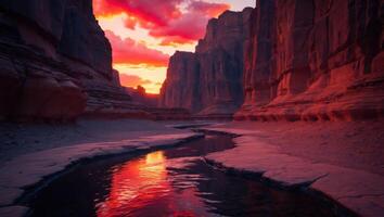 River Flows Through Canyon with Stunning Red Sunset Reflection photo
