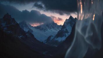 Mountain Range with Clouds and Sunset Glow in Cold Tones photo