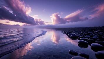 Purple Sunset Over a Pebble Beach with Ocean Waves photo