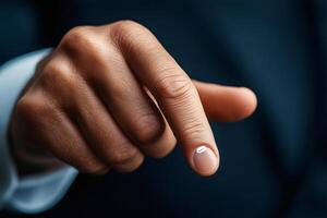 Businessman pointing with index finger towards the viewer photo