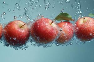 Fresh Red Apples Submerged in Sparkling Water with Air Bubbles photo
