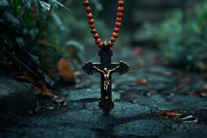 Ornate Crucifix with Rosary on Wet Cobblestone Path photo