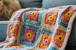 Cozy crochet blanket with colorful square patterns photo