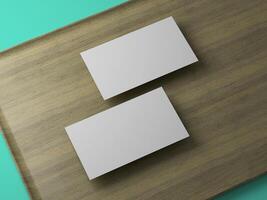 Diagonal composition of blank business cards on wood and teal combo background, ideal for creatives. photo