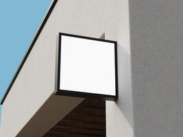 Professional blank sign mockup with a sleek black frame, ideal for logo branding on a building's corner. photo