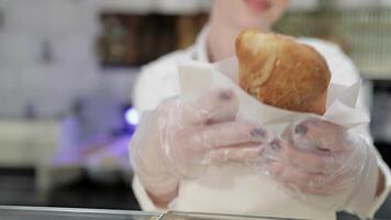 Delightful baker presents fresh pastries with a warm smile video