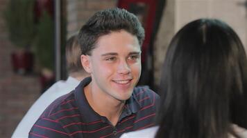 Close up of a young man enjoying a drink at the bar video