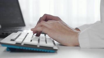 Focused female hands gracefully typing on a sleek computer keyboard video