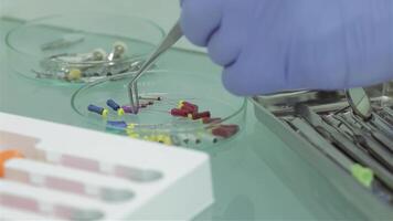 Dentist prepares colorful dental tools for a procedure video