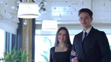 Charming couple enjoying a romantic dinner in an elegant restaurant video