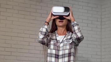 Excited young woman exploring virtual reality with sleek VR headset video