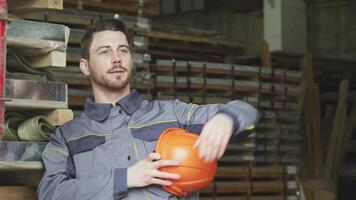 Cheerful metalworker relaxing after a busy day, smiling and looking away video