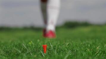 Focused female golfer prepares to tee off with precision video