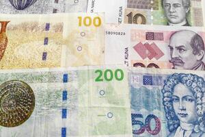Stack of Danish Kroner and Croatian Kuna photo