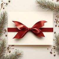 Elegant Christmas Gift Card with Red Bow and Pine Branches photo
