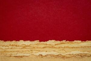abstract Martian desert landscape in red, orange and yellow pastel tones - a collection of handmade rag papers photo