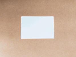Blank label on rustic cardboard. Simple, clean image for delivery, shipping, or organization concepts. Space for textlogo. Versatile backdrop for presentations. photo