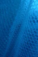 Same Size Circle Elements On Blue Stretched Surface. Textured Stock Image With Blue Cells Abstract Pattern photo