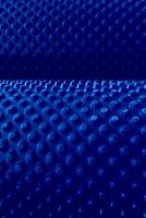 Abstract Background With Blue Extruded Cells On Rolled Surface. Pattern Of Abstract Blue Elements In A Rolls photo