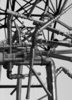 Dark Iron Pipe Network Chaotic Structure. Stock Photo For Pipe Transport Illustration