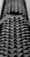 Identically spikes on jagged gray mechanism stock photo for vertical background