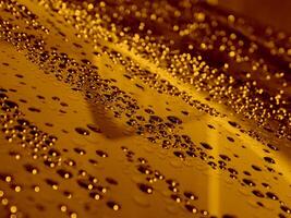 Shiny Golden Drops On Glossy Surface With Selective Focus Stock Photo For Liquid Gold Backgrounds
