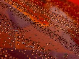 Abstract Pattern Of Liquid Drops On Glass Surface With Colored Backlight photo
