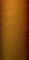 Pattern of variety size drops on golden glossy surface. Stock Photo For Abstract Golden Vertical Backgrounds