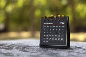 Calendar page November of the year 2026 on a natural background, with copy space and business design. Concept of monthly planning, important schedules, meetings, and appointments. photo