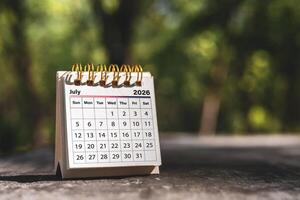 Calendar page July of the year 2026 on a natural background, with copy space and business design. Concept of monthly planning, important schedules, meetings, and appointments. photo