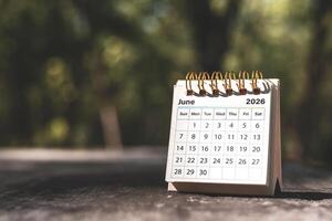 Calendar page June of the year 2026 on a natural background, with copy space and business design. Concept of monthly planning, important schedules, meetings, and appointments. photo