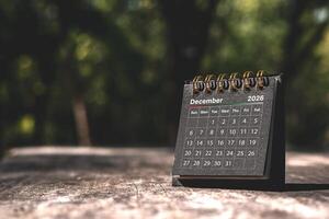 Calendar page December of the year 2026 on a natural background, with copy space and business design. Concept of monthly planning, important schedules, meetings, and appointments. photo