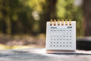 Calendar page January of the year 2026 on a natural background, with copy space and business design. Concept of monthly planning, important schedules, meetings, and appointments. photo