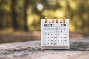 Calendar page September of the year 2026 on a natural background, with copy space and business design. Concept of monthly planning, important schedules, meetings, and appointments. photo