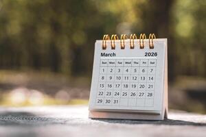 Calendar page March of the year 2026 on a natural background, with copy space and business design. Concept of monthly planning, important schedules, meetings, and appointments. photo
