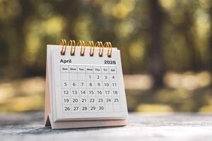 Calendar page April of the year 2026 on a natural background, with copy space and business design. Concept of monthly planning, important schedules, meetings, and appointments. photo