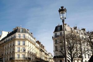 Captivating Charm of Parisian Architecture Beneath a Lovely Clear Blue Sky photo
