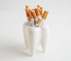 Cigarette with teeth isolated on white background with copy space, No smoking, damage the health of you photo