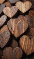 a close up view of a pile of wooden hearts each heart has a different wood grain pattern and color photo