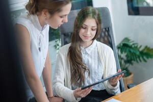 Discussing project ideas during a brainstorming session in a modern office photo