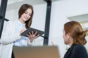 Engaging discussion in a modern office environment with a focus on teamwork and collaboration photo