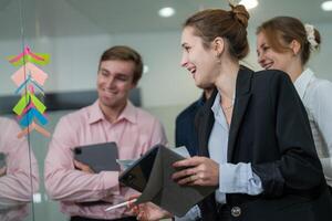 Team collaboration during a brainstorming session in a modern office setting in the afternoon photo