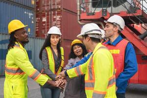 Diverse Team of Workers Motivated and Excited, Industrial Team Celebrating Success at Shipping Container Yard photo