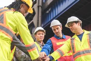 Diverse Team of Engineer and Workers Motivated and Excited, Industrial Team Celebrating Success at Shipping Container Yard photo