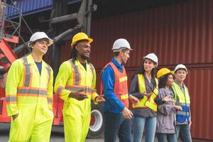Engineer and foreman worker team in industry containers yard, Success teamwork concepts photo
