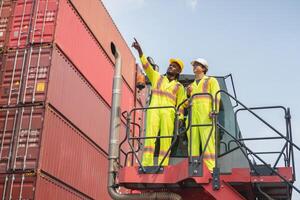 Engineer man Team in Safety Gear Control Containers Box at Container Cargo, Container Dock Workers Team Discussion at Shipping Yard photo